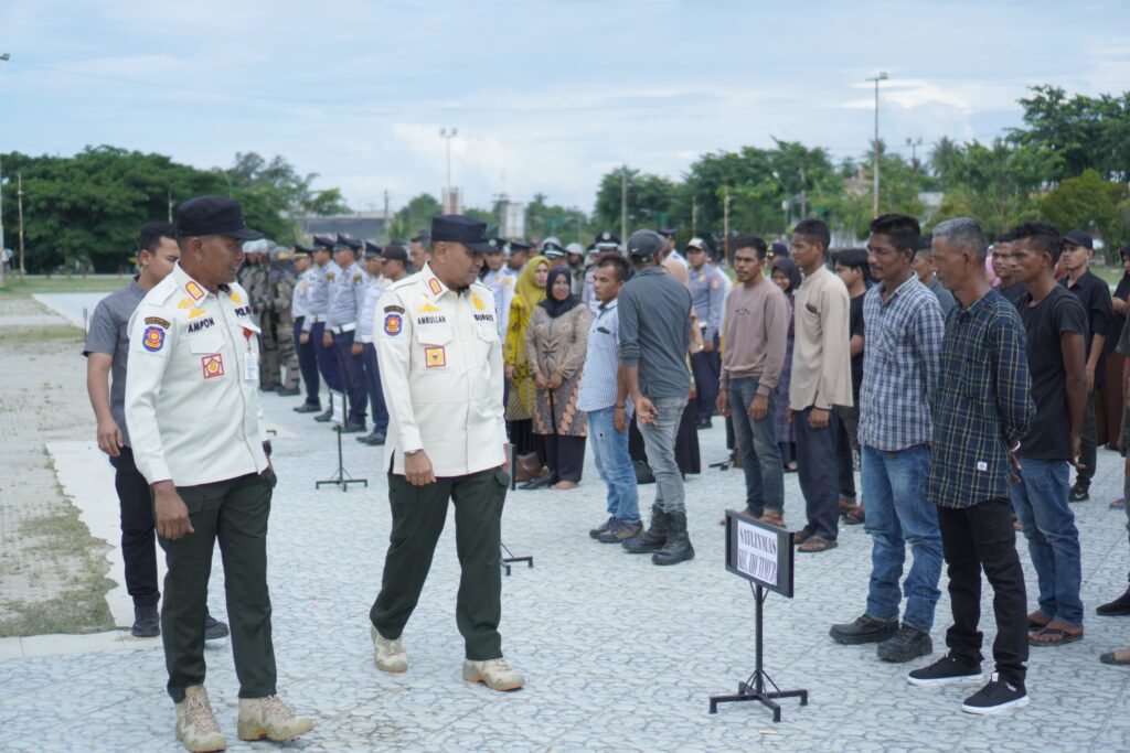 Pemkab Aceh Timur Gelar Upacara Penyerahan Satlinmas PAM TPS